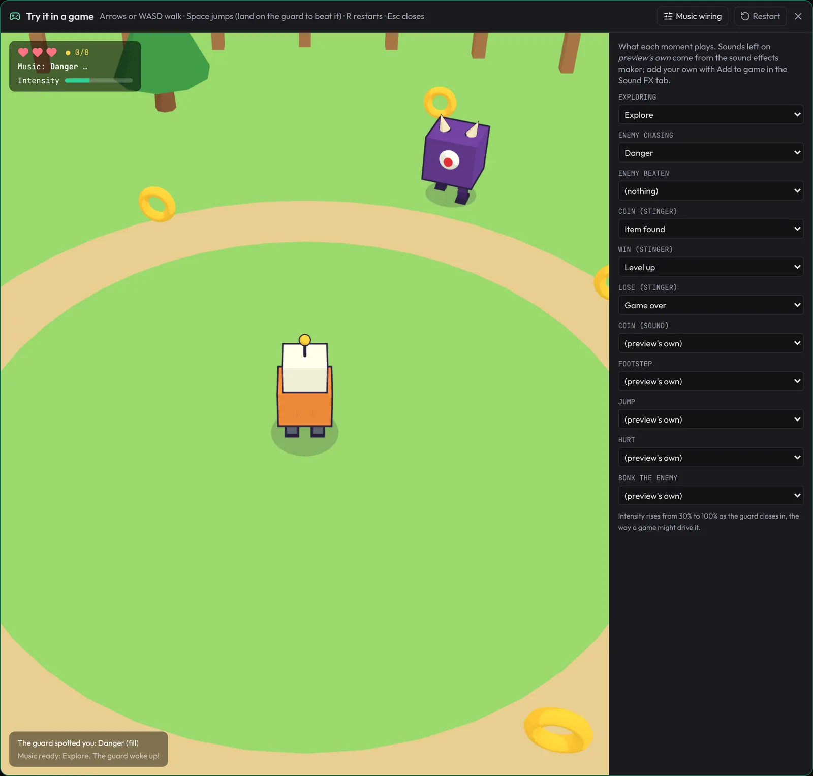Try it in a game: a small 3D field with a little orange robot in the middle, coins around it and a purple one-eyed cube guard at the top. The panel at the top left shows three hearts, the coins, the music state playing and the intensity; Music wiring is open on the right.